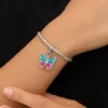 Dije de plata con mariposa esmaltada en turquesa y rosa