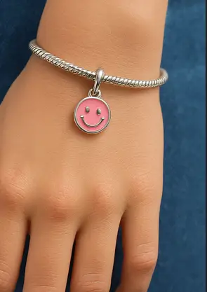 Dije rosa de carita feliz